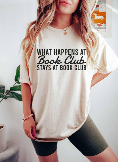 A comfort colors® shirt with the saying "what happens at book club stays at book club"