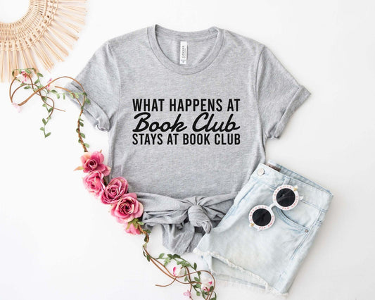 A comfort colors® shirt with the saying "what happens at book club stays at book club"
