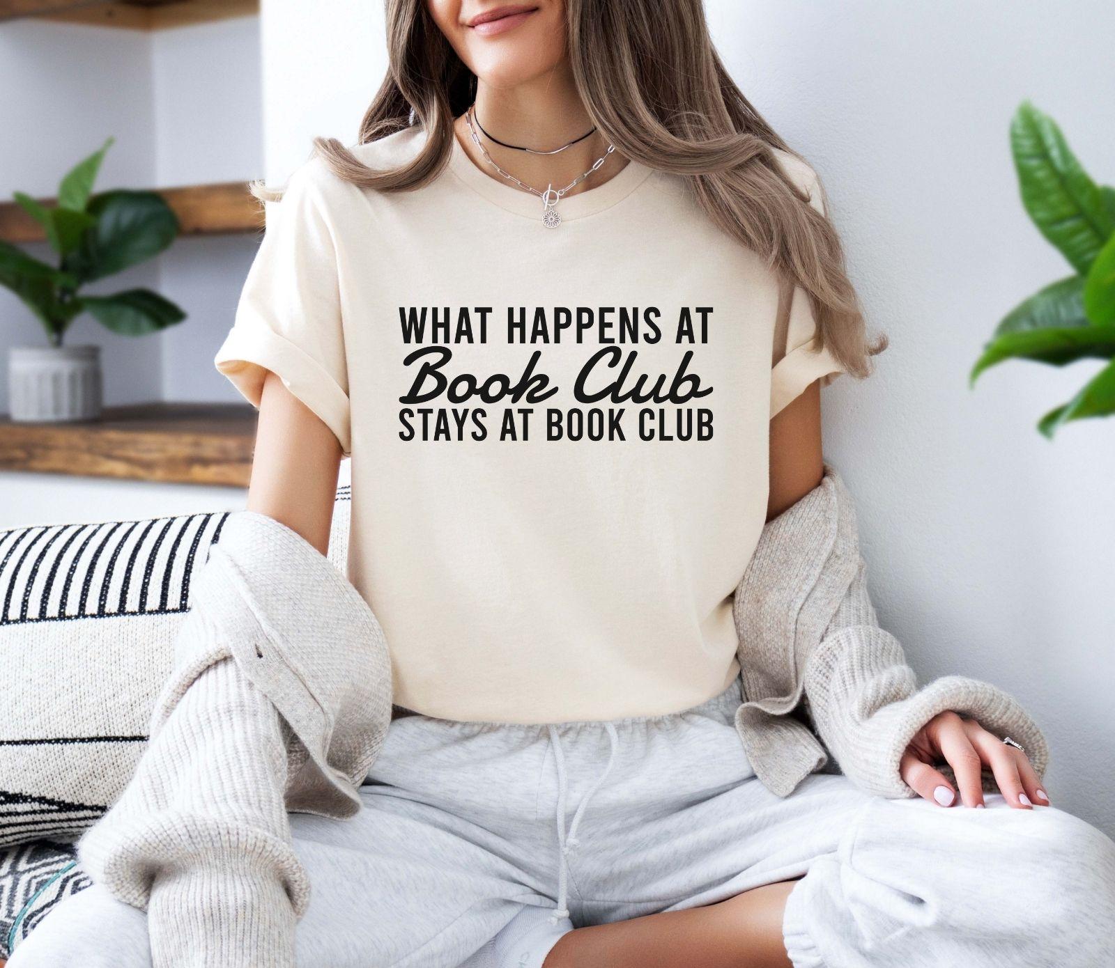 A comfort colors® shirt with the saying "what happens at book club stays at book club"