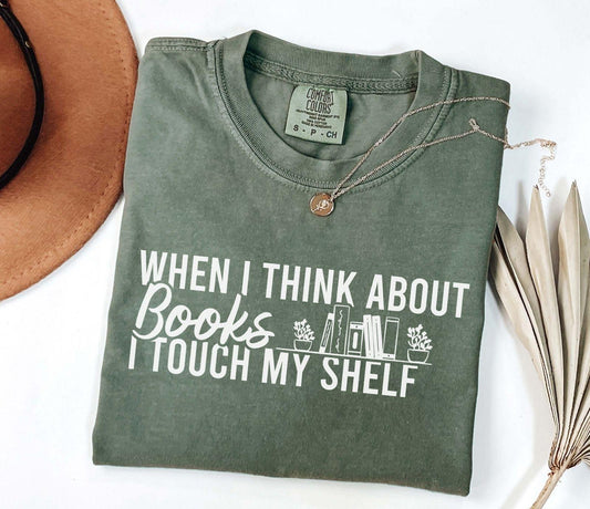 A comfort colors® shirt with the saying "When I think about books I touch my shelf"