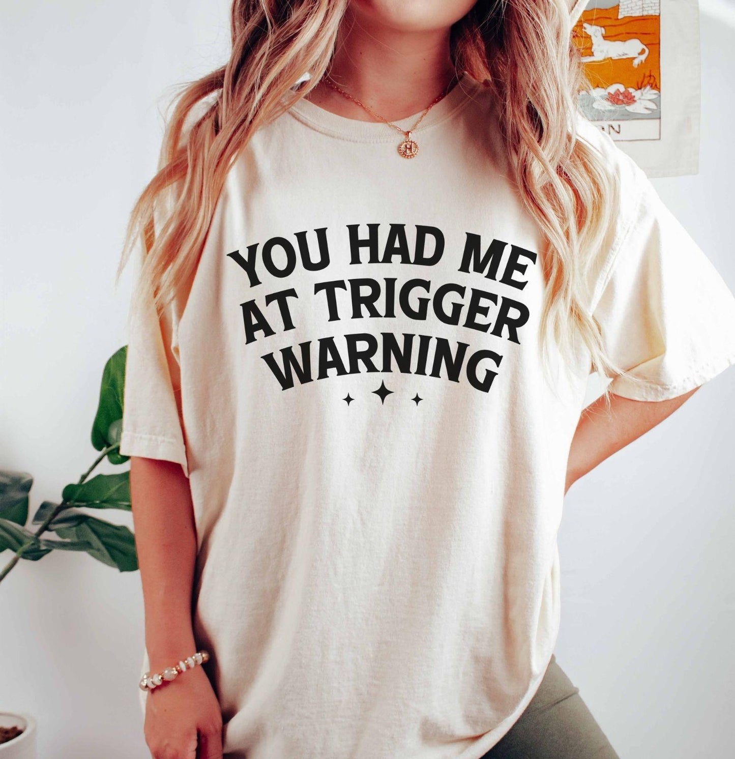 A comfort colors® shirt with the saying "you had me at trigger warning"