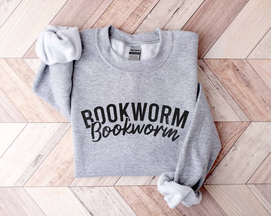 A sport grey color sweatshirt with the saying "Bookworm"
