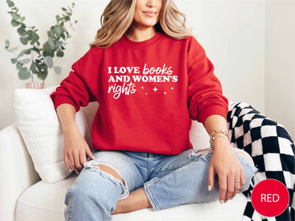 Person wearing a red sweatshirt with text, sitting on a white couch.
